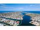 Expansive aerial shot showcasing a coastal community with canals and luxurious waterfront homes at 542 67Th St, Holmes Beach, FL 34217