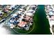 A high-angle aerial view highlighting a waterfront home with a tile roof and lush landscaping at 542 67Th St, Holmes Beach, FL 34217