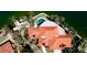 Expansive waterfront estate showcasing a meticulously maintained tile roof and lush tropical landscaping at 542 67Th St, Holmes Beach, FL 34217