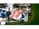 Detailed aerial view of a luxurious home showcasing a red tile roof, private pool, and waterfront access at 542 67Th St, Holmes Beach, FL 34217