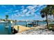 Home featuring a waterfront dock and boat lift, ideal for boating and water sports at 542 67Th St, Holmes Beach, FL 34217