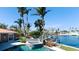 Relaxing outdoor oasis featuring a pool, spa, and stunning water views at 542 67Th St, Holmes Beach, FL 34217