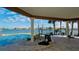 Inviting outdoor space featuring a covered patio, pool, and beautiful water views at 542 67Th St, Holmes Beach, FL 34217