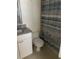 Bathroom featuring a granite vanity, a toilet, and decorative shower curtain that adds style and functionality at 7211 W Country Club N Dr # 135, Sarasota, FL 34243
