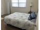 Comfortable bedroom with a cozy bed, a standing mirror, and ample closet space offering practical and aesthetic appeal at 7211 W Country Club N Dr # 135, Sarasota, FL 34243