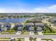 Gorgeous aerial view of lakeside homes, showcasing the community's scenic waterfront and lush landscaping at 8609 Evening Dr, Sarasota, FL 34241