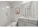 Stylish bathroom featuring glass shower, and modern vanity with copper fixtures at 8609 Evening Dr, Sarasota, FL 34241