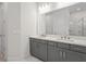 Sleek bathroom with dual sinks, modern fixtures, and a clean, minimalist design at 8609 Evening Dr, Sarasota, FL 34241