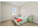 Bright bedroom with a large window and blue accent decorations at 8609 Evening Dr, Sarasota, FL 34241