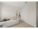 Cozy bedroom featuring a daybed, two decorative guitars, and a closet at 8609 Evening Dr, Sarasota, FL 34241