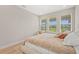 Serene bedroom with soft colors, plush bedding, and large windows for natural light at 8609 Evening Dr, Sarasota, FL 34241