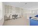 Bonus room on second floor is decorated with two desks, chairs, and a keyboard at 8609 Evening Dr, Sarasota, FL 34241