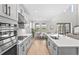 Modern kitchen with sleek countertops, stainless steel appliances, and a seamless open layout at 8609 Evening Dr, Sarasota, FL 34241