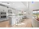 Open-concept kitchen featuring modern appliances, a large island, and bar stool seating at 8609 Evening Dr, Sarasota, FL 34241