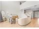 Bright living room with modern furniture, hardwood flooring, and a staircase at 8609 Evening Dr, Sarasota, FL 34241