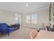 Upstairs loft featuring cozy seating, desk space and lots of natural light at 8609 Evening Dr, Sarasota, FL 34241