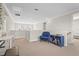 Bright loft space featuring a comfortable seating area and built in desk space at 8609 Evening Dr, Sarasota, FL 34241