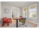 Bright home office featuring ample natural light, modern furnishings, and a comfortable workspace at 8609 Evening Dr, Sarasota, FL 34241