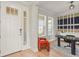 Entryway view into a well-lit home office with stylish furnishings at 8609 Evening Dr, Sarasota, FL 34241