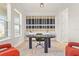 Modern home office featuring stylish accent wall and unique decorative furnishings at 8609 Evening Dr, Sarasota, FL 34241