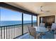 This tiled balcony has a seating arrangement and boasts stunning views of the ocean at 900 Gulf Blvd # 805, Indian Rocks Beach, FL 33785