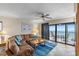 Relax in this bright living room with large windows and balcony access, with ocean views at 900 Gulf Blvd # 805, Indian Rocks Beach, FL 33785