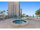 Resort-style pool and hot tub with ocean views offer relaxation and recreation for residents at 900 Gulf Blvd # 805, Indian Rocks Beach, FL 33785