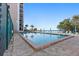 Community pool with beach view and lounge chairs at 900 Gulf Blvd # 805, Indian Rocks Beach, FL 33785