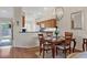 The dining room has great lighting and is adjacent to the kitchen in the home at 9540 High Gate Dr # 1426, Sarasota, FL 34238