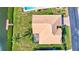 An aerial view shows the home's layout, tile roof, canal access, and private pool at 104 Inlets Blvd # 104, Nokomis, FL 34275