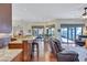 Open floor plan with kitchen, casual dining area, and Gathering room with access to lanai at 104 Inlets Blvd # 104, Nokomis, FL 34275