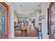 Inviting living room featuring hardwood floors, neutral walls, and comfortable seating with a view at 104 Inlets Blvd # 104, Nokomis, FL 34275