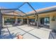 Wide angle of the covered patio featuring outdoor dining and seating, perfect for entertaining guests at 104 Inlets Blvd # 104, Nokomis, FL 34275