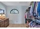 Bright walk-in closet showcasing custom shelving, a window, and plenty of space for storage at 104 Inlets Blvd # 104, Nokomis, FL 34275