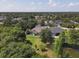 This aerial view shows the property's proximity to a pond, lush landscaping, and surrounding neighborhood at 13811 Nighthawk Ter, Lakewood Ranch, FL 34202
