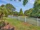 The backyard is spacious and offers privacy with lush landscaping and a pond view at 13811 Nighthawk Ter, Lakewood Ranch, FL 34202