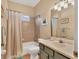 Cozy bathroom featuring a shower and bathtub, complemented by a neutral color scheme at 13811 Nighthawk Ter, Lakewood Ranch, FL 34202