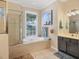 Bathroom featuring a soaking tub, shower, and vanity with ample counter space at 13811 Nighthawk Ter, Lakewood Ranch, FL 34202