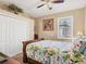 Well-lit bedroom featuring a comfortable bed, closet space, and a window offering natural light at 13811 Nighthawk Ter, Lakewood Ranch, FL 34202