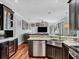 Kitchen area with granite countertops, stainless steel appliances, and access to the living room at 13811 Nighthawk Ter, Lakewood Ranch, FL 34202