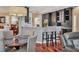 Stylish kitchen featuring dark cabinetry, granite countertops, and modern bar stool seating at 13811 Nighthawk Ter, Lakewood Ranch, FL 34202