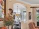 Open-concept living room with hardwood floors and an archway to another living area at 13811 Nighthawk Ter, Lakewood Ranch, FL 34202