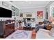 Well-decorated office space featuring a desk, comfortable seating, and decorative wall art at 13811 Nighthawk Ter, Lakewood Ranch, FL 34202
