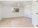 Bright bedroom with tile floors, fan and a window with lots of natural light at 145 Glenholm Ave, Punta Gorda, FL 33950