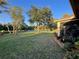Backyard boasts lush lawn, pond view, and beautiful landscaping, perfect for outdoor enjoyment and entertaining at 15207 17Th E Ave, Bradenton, FL 34212