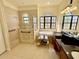 Spacious bathroom with tub and shower, tiled walls, and abundant natural light at 15207 17Th E Ave, Bradenton, FL 34212