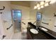 Accessible bathroom with granite counter, shower, grab bars and tile flooring for safe and easy use at 15207 17Th E Ave, Bradenton, FL 34212