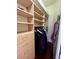 Organized closet with custom shelving, drawers, and hanging space for clothing at 15207 17Th E Ave, Bradenton, FL 34212