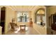 Dining area with large windows, chandelier lighting, and decorative columns at 15207 17Th E Ave, Bradenton, FL 34212