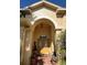 Covered entryway features an arched doorway and view of the double doors with sidelights at 15207 17Th E Ave, Bradenton, FL 34212